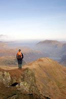 06-2207 Hill walker enjoying the view north over Brothers Water from Red Screes, Lake District, Cumbria
